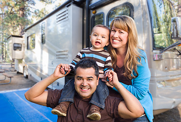 Image showing Happy Young Mixed Race Family In Front of Their Beautiful RV At 