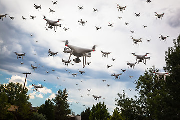 Image showing Dozens of Drones Swarm in the Cloudy Sky.