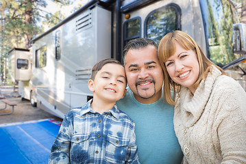 Image showing Happy Young Mixed Race Family In Front of Their Beautiful RV At 