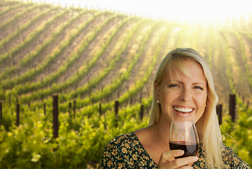 Image showing Attractive Young Woman With Wine Glass in A Vineyard.