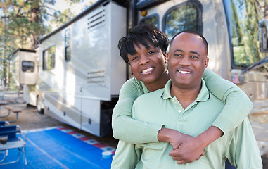 Image showing Happy African American Couple In Front of Their Beautiful RV At 