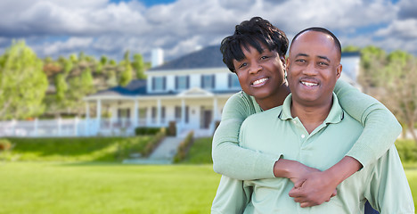 Image showing Happy African American Couple In Front of Beautiful House.