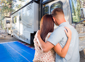 Image showing Military Couple Looking At A Beautiful RV At The Campground.