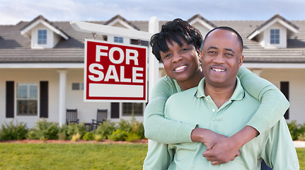 Image showing Happy African American Couple In Front of Beautiful House and Fo