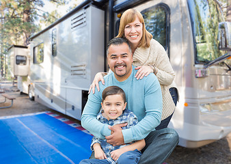 Image showing Happy Young Mixed Race Family In Front of Their Beautiful RV At 