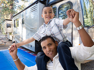 Image showing Happy Hispanic Father and Son In Front of Their Beautiful RV At 