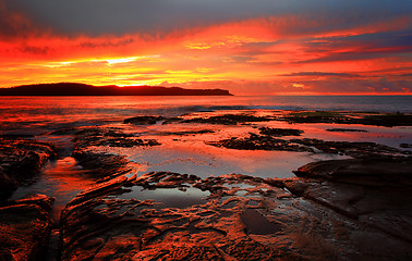 Image showing Red sunrise blankets Pearl Beach Australia