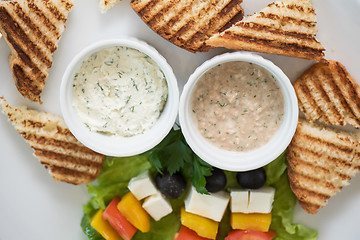 Image showing toast with cheese vegetables and olive on the stick