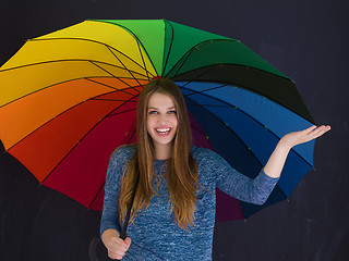 Image showing handsome woman with a colorful umbrella