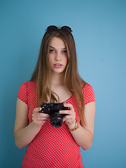 Image showing beautiful girl taking photo on a retro camera