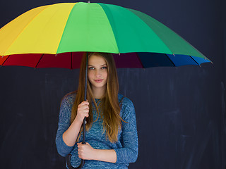 Image showing handsome woman with a colorful umbrella