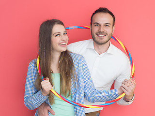 Image showing portrait of happy couple with hula hoop