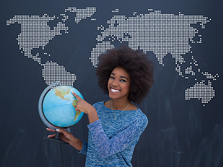 Image showing black woman holding Globe of the world