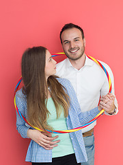 Image showing portrait of happy couple with hula hoop