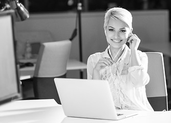 Image showing Businesswoman using headset at work