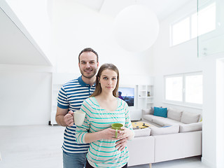 Image showing young handsome couple enjoying morning coffee