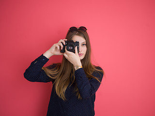 Image showing girl taking photo on a retro camera