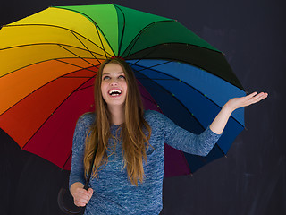 Image showing handsome woman with a colorful umbrella