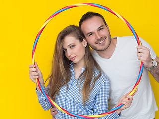 Image showing portrait of young couple with hula hoop