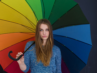Image showing handsome woman with a colorful umbrella