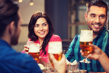 Image showing friends dining and drinking beer at restaurant