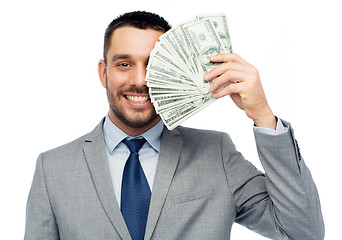 Image showing smiling businessman with american dollar money