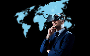 Image showing businessman in virtual reality headset over black