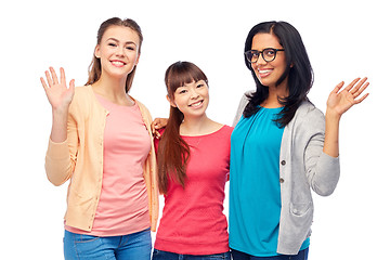 Image showing international group of happy women waving hands