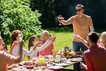 Image showing happy family having dinner or summer garden party