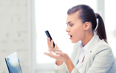 Image showing woman shouting into smartphone