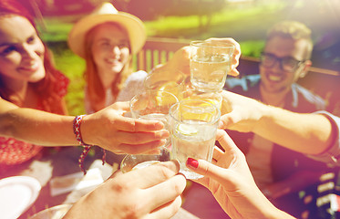 Image showing happy friends with drinks at summer garden party