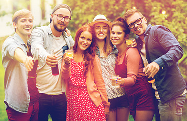 Image showing happy friends with drinks at summer garden party