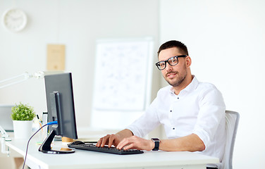 Image showing businessman typing on computer keyboard at office