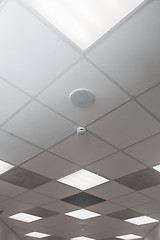 Image showing Office room ceiling with smoke detector and alarm