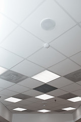 Image showing Office room ceiling with smoke detector and alarm