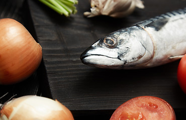 Image showing Mackerel and vegetables on a wooden table