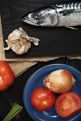 Image showing Mackerel and vegetables on a wooden table