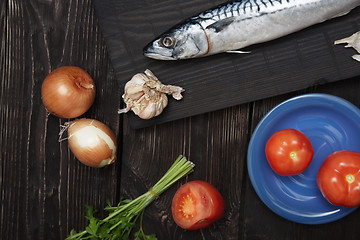 Image showing Mackerel and vegetables on a wooden table