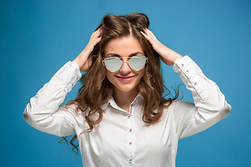 Image showing The young woman\'s portrait with happy emotions