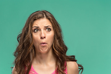 Image showing Portrait of young woman with shocked facial expression