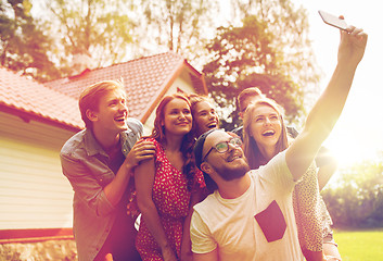 Image showing friends taking selfie at party in summer garden