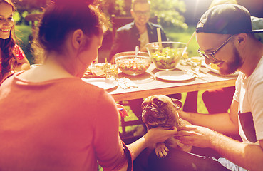 Image showing happy friends having dinner at summer garden party