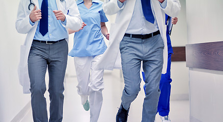 Image showing close up of medics or doctors running at hospital