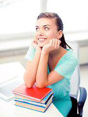 Image showing happy smiling student girl with books