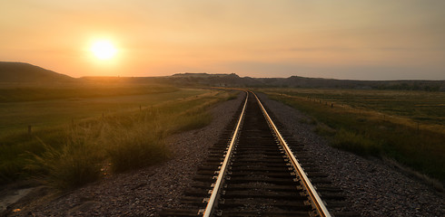 Image showing Railroad Tracks Reflect Sunrise Rural American Transportation La