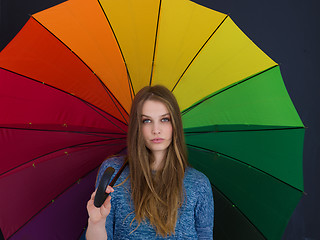 Image showing handsome woman with a colorful umbrella