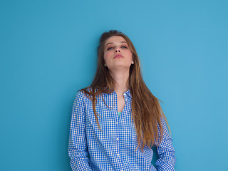 Image showing young woman playing with her long silky hair