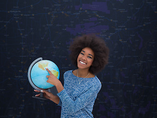 Image showing black woman holding Globe of the world