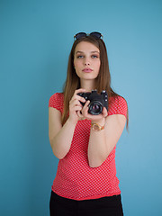 Image showing beautiful girl taking photo on a retro camera