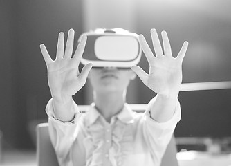 Image showing Young woman using vr glasses